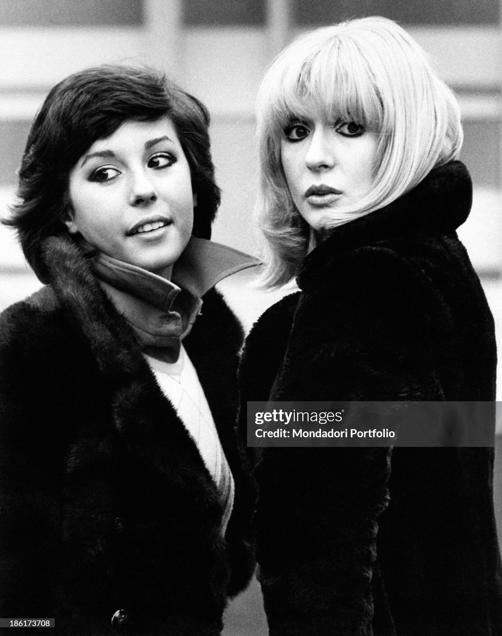 The Italian actress and singer Daniela Goggi (on the left) is posing next to her older sister, the singer, actress and show girl Loretta, in Milan in 1973.