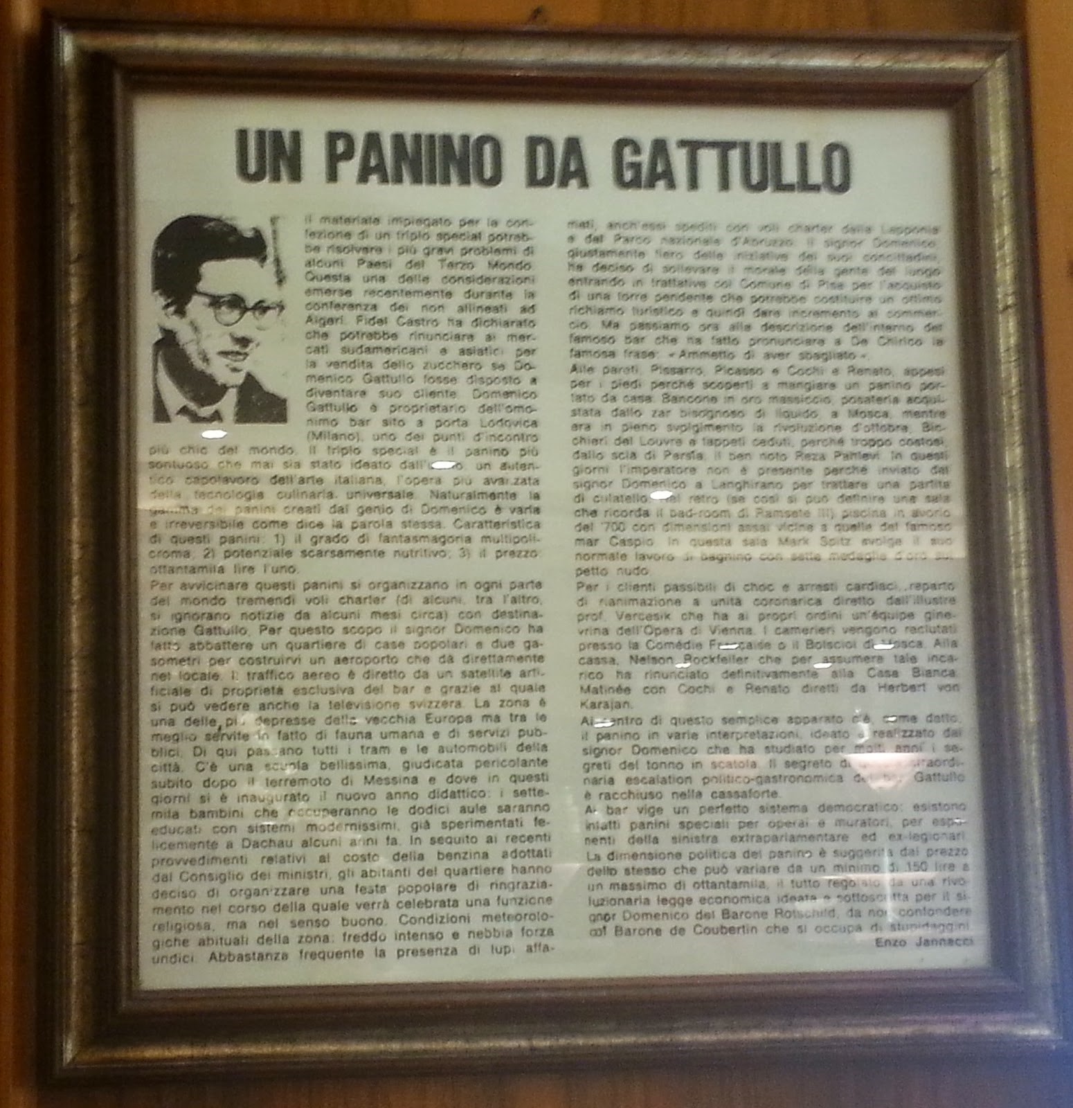 A painting hanging in the Gattullo bar with an article by Enzo Jannacci.