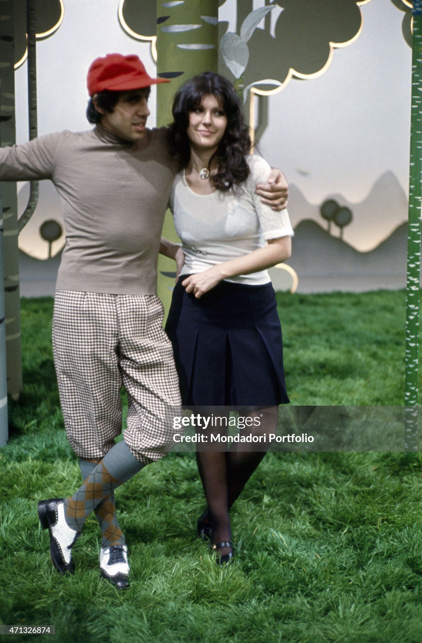 Adriano Celentano hugging his wife Claudia Mori (Claudia Moroni) on the set of a TV show in 1972. 