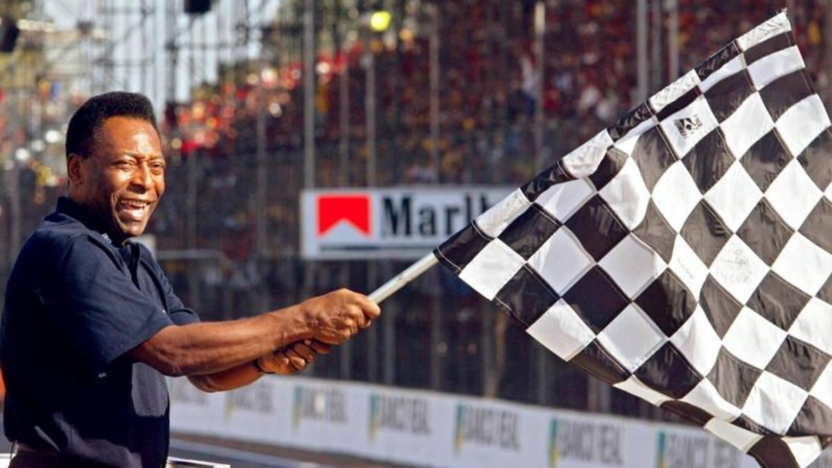 Pele' waving the chequered flag.