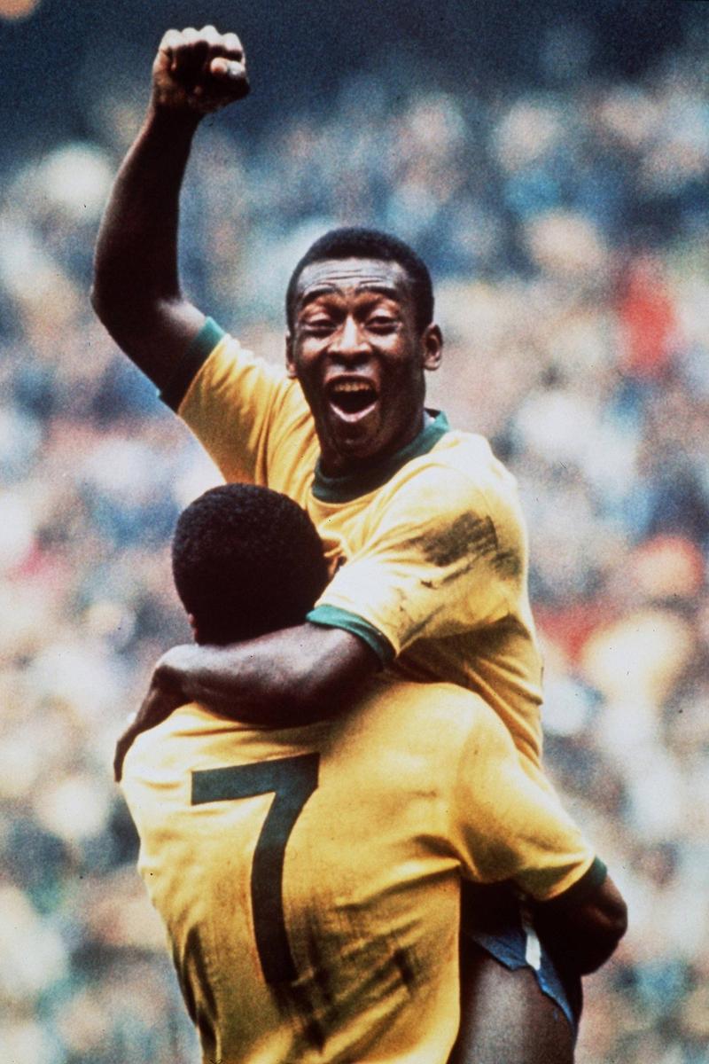 Pele of Brazil celebrates with teammate Jairzinho at the 1970 FIFA World Cup in Mexico.