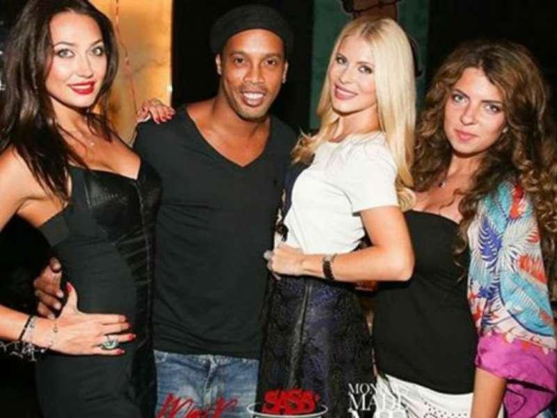Ronaldinho with three women.
