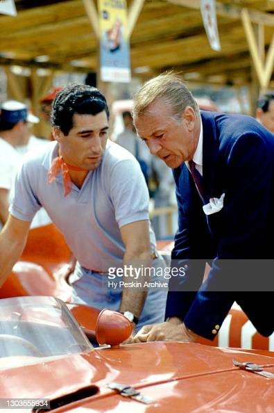 Alfonso de Portago talks with actor Gary Cooper, as they look at the n.12 Ferrari 860S Monza before the Grand Prix of Cuba race on February 24, 1957 in Havana, Cuba.