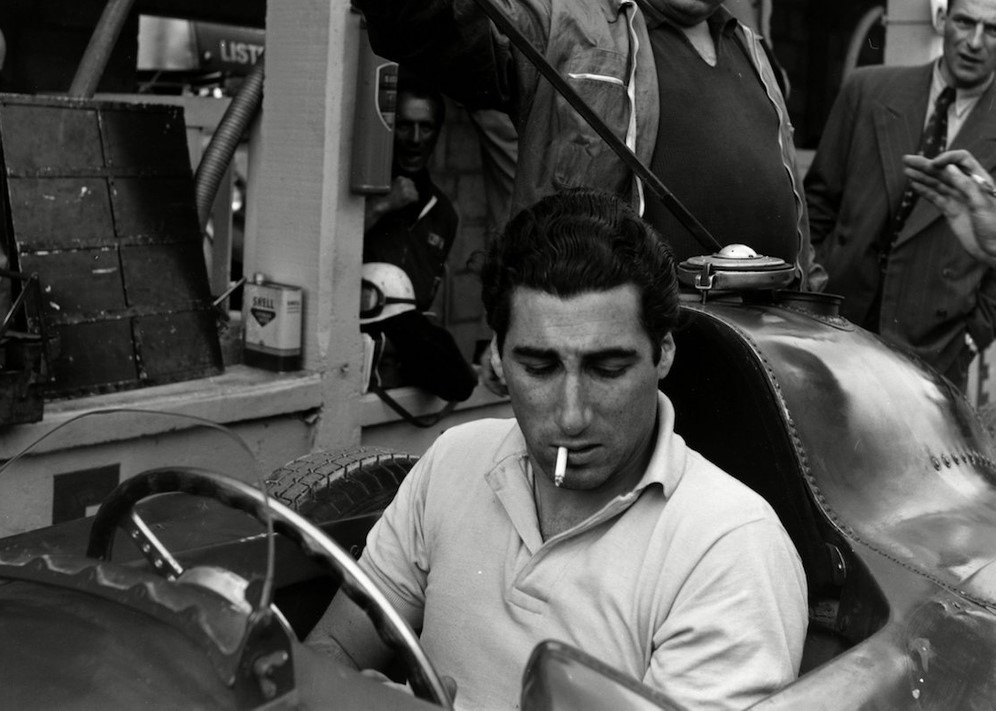   Alfonso de Portago checks over his Lancia-Ferrari D50, Exhibition French Grand Prix, Reims, 1956. 