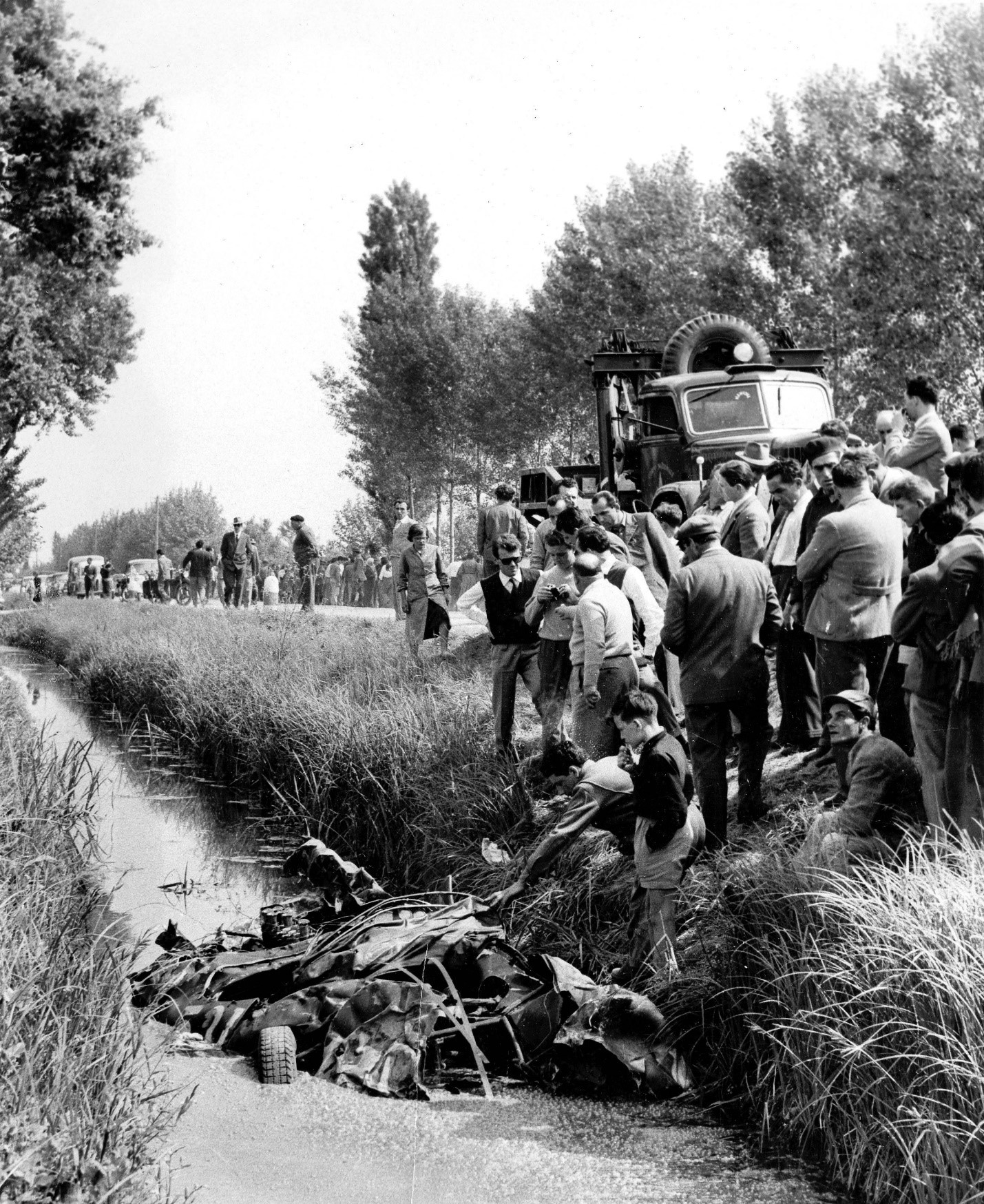 Alfonso de Portago's Ferrari 335 remains in the ditch where the car ended, after killing 10.