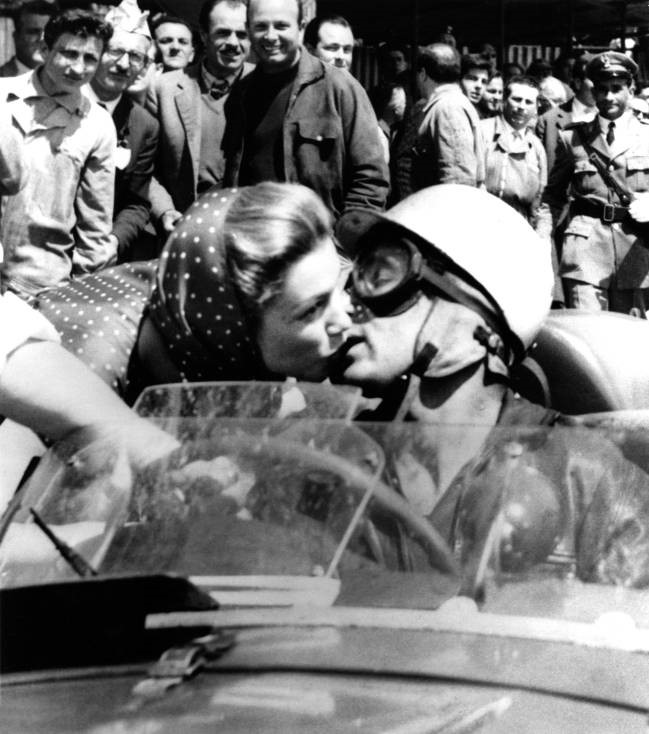 Linda Christian and the marquis de Portago kiss at the 1957 Mille Miglia. 