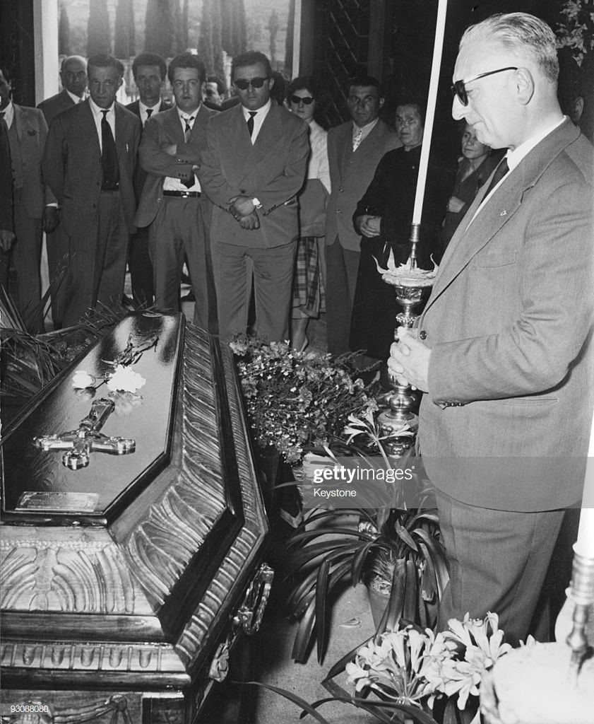 Italian race car driver and businessman Enzo Ferrari attends the funeral of Spanish racing driver Alfonso de Portago, 14th May 1957.