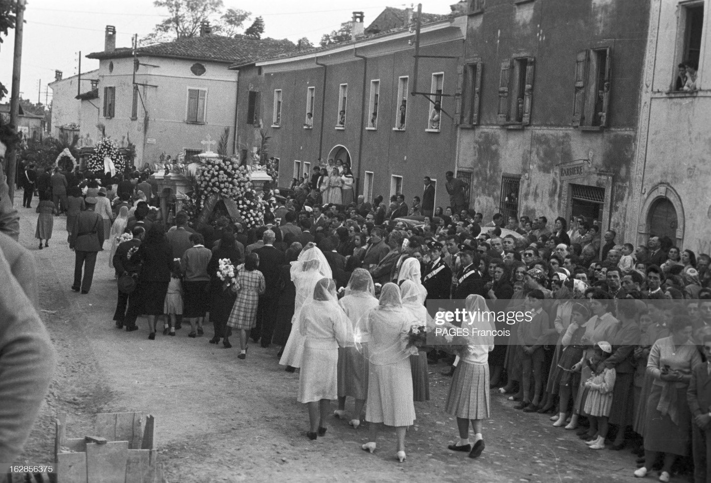 Funeral of marquis de Portago and the victims of his accident at the Thousand Miles race. Guidizzolo, Italy, May 14, 1957. Many people came to pay their last respects to the victims. 