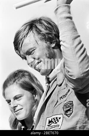 Ronnie Peterson standing on the podium after winning the Formula 3 race in Karlskoga in 1965.