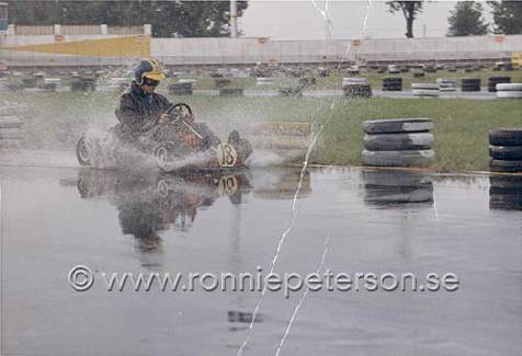 Ronnie Peterson driving his kart in the rain.