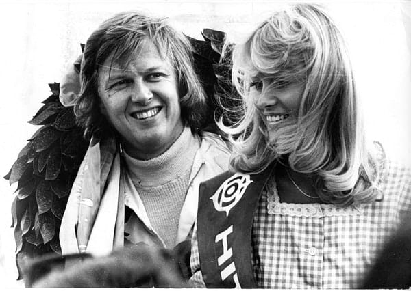 Ronnie Peterson on the podium with a girl.