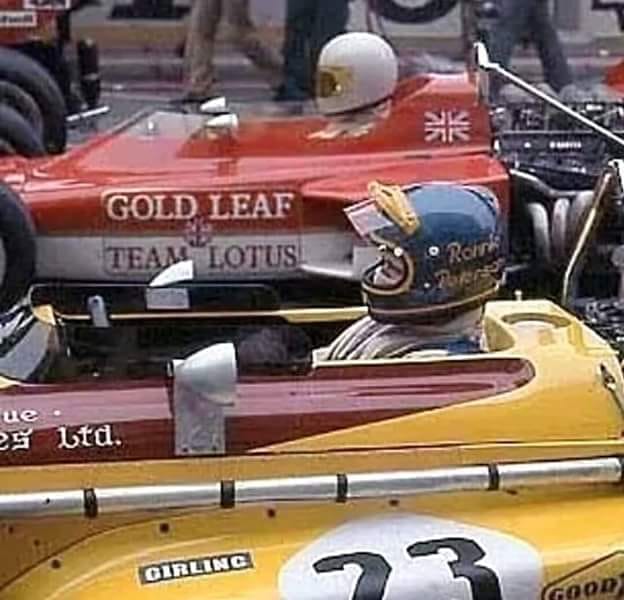 Ronnie Peterson, March, at the start near John Miles, Lotus.