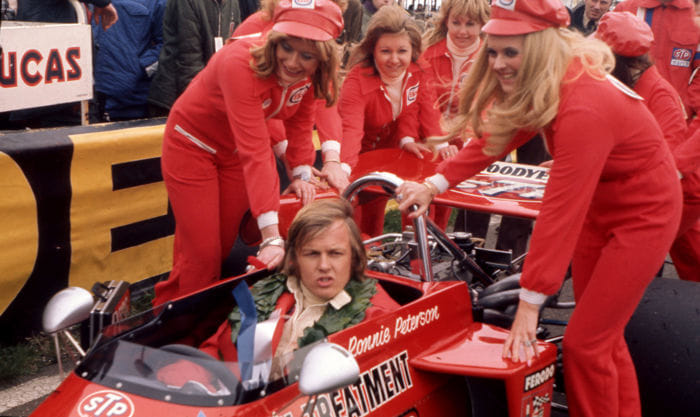 Ronnie Peterson in his car with some girls.