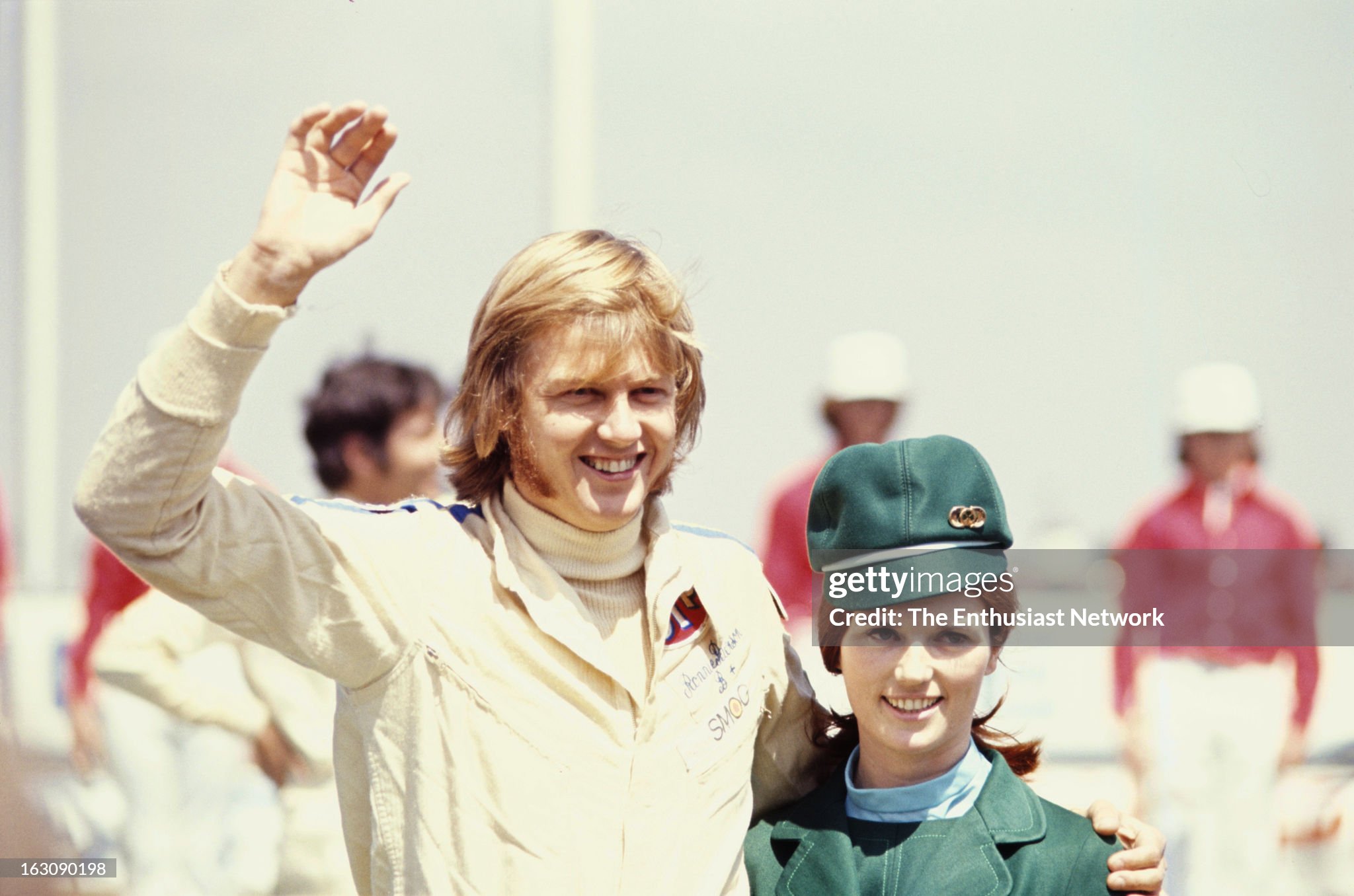 Ronnie Peterson of March racing stands with a grid girl at the Questor Grand Prix at the Ontario Motor Speedway in California, USA, on 30 March 1971. 
