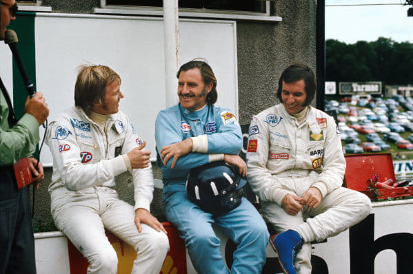 Ronnie Peterson, March 712M, 1st position, sits with Graham Hill and Emerson Fittipaldi at Brands Hatch, England, on 30 August 1971. 