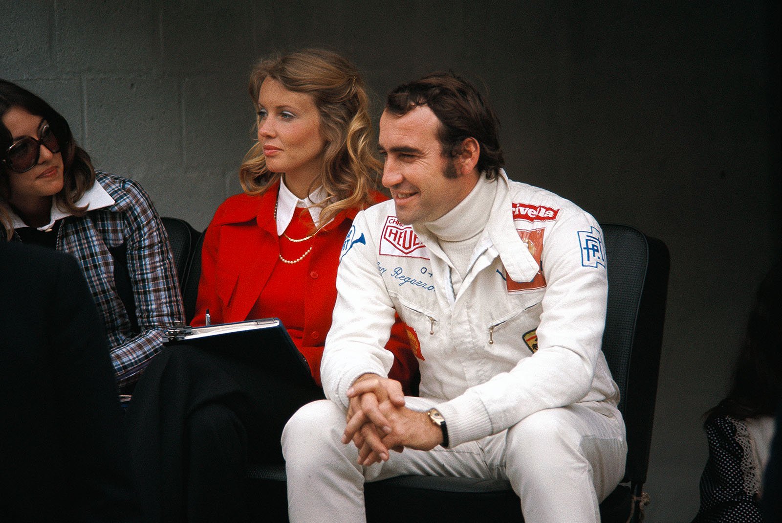 Clay Regazzoni next to his team-mate's wife Barbro Peterson at Nivelles, Belgium, on 04 June 1972. 