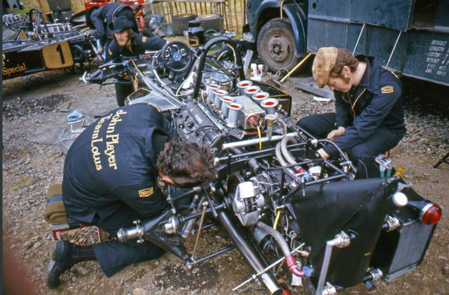Mechanics working on a Lotus 72.