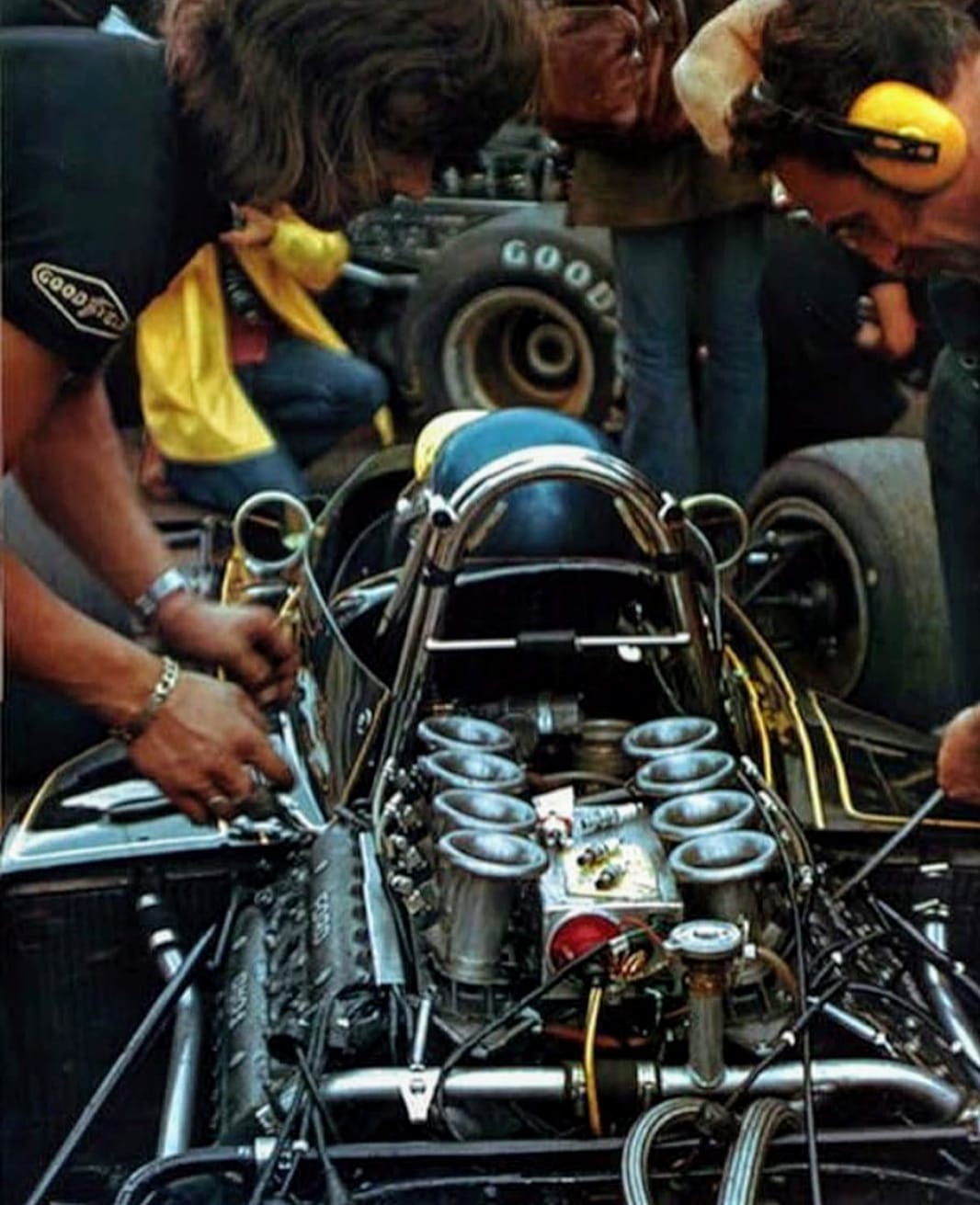 Mechanics working on a Lotus.