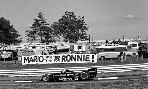 Mario Andretti, Lotus 79 Ford, drives past a banner from a fan at the US GP in Watkins Glen on 01 October 1978. Ronnie Peterson had died at the recent Italian Grand Prix in Monza. 