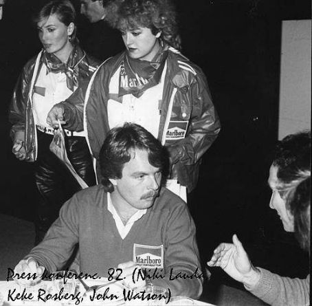 Keke Rosberg, Niki Lauda and John Watson with two Marlboro girls in 1982.