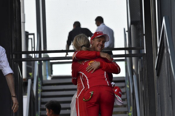 Britta Roeske with Sebastian Vettel at Ferrari.