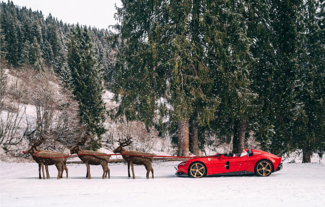 A red Ferrari pulled by six reindeers.