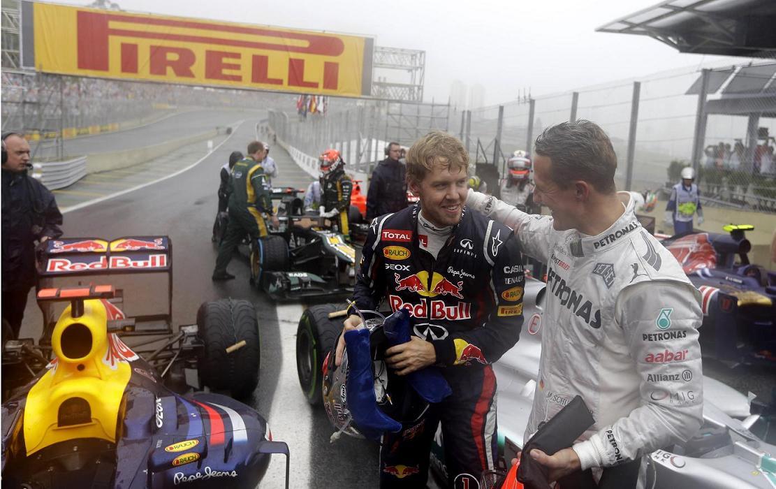 Sebastian Vettel invested by Michael Schumacher at Brazilian GP in 2012.