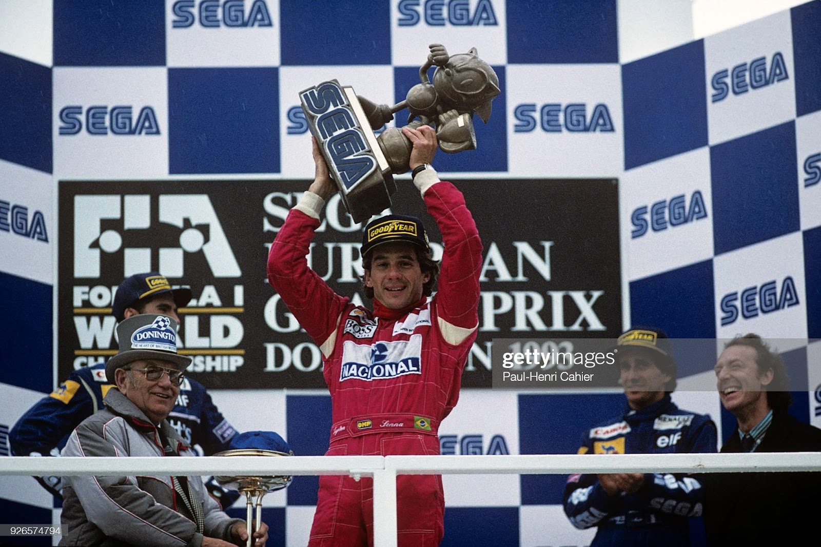 Ayrton Senna holds a trophy