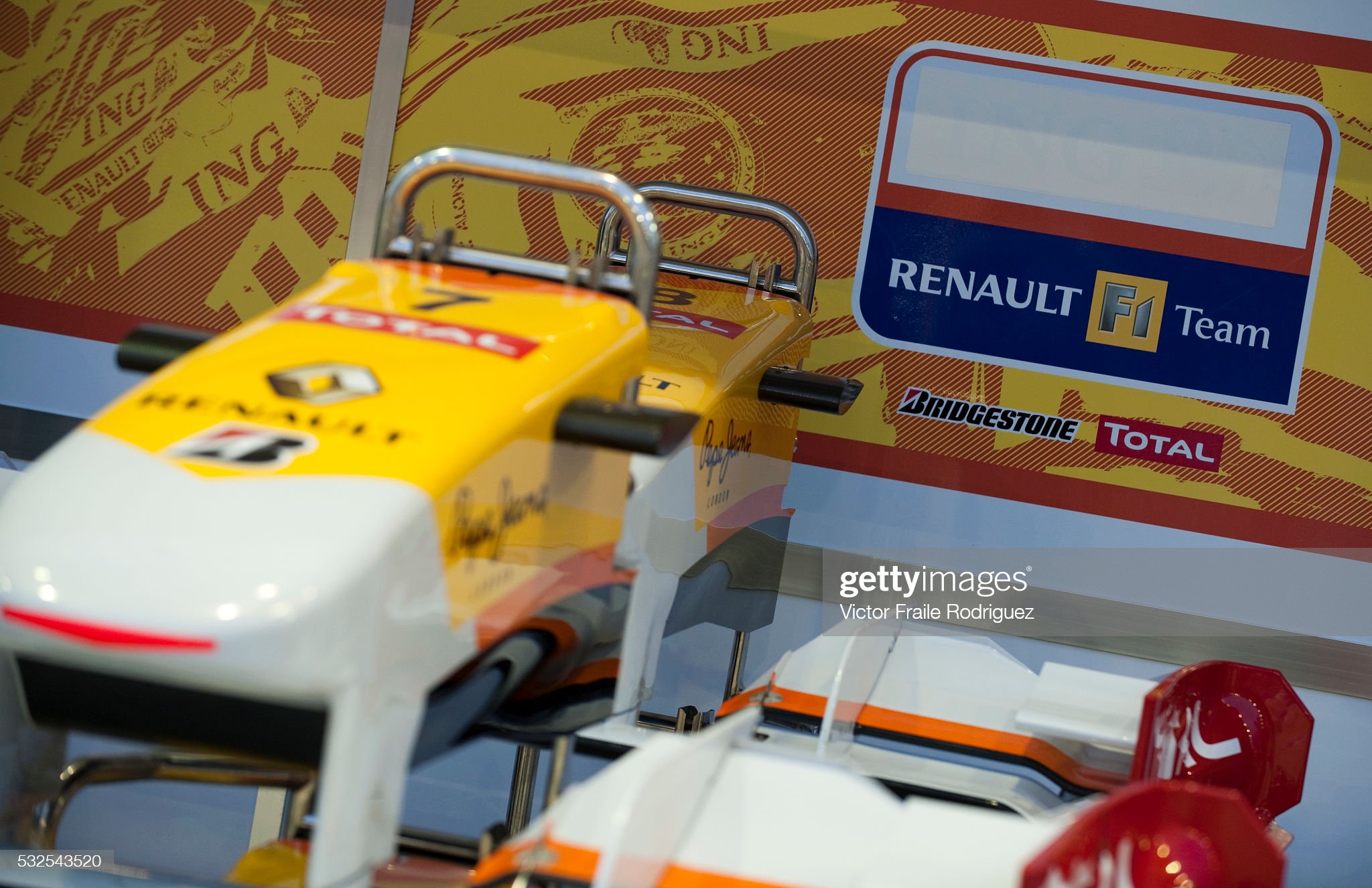 Renault Formula One cars are parked inside the pits without ING sponsor logos before the Formula One Singapore Grand Prix, the world's only street night race, at the Marina Bay street circuit on 27 September 2009. Renault suffered further fallout from a race-fixing scandal when sponsors ING and Mutua Madrilena retired their contracts. 