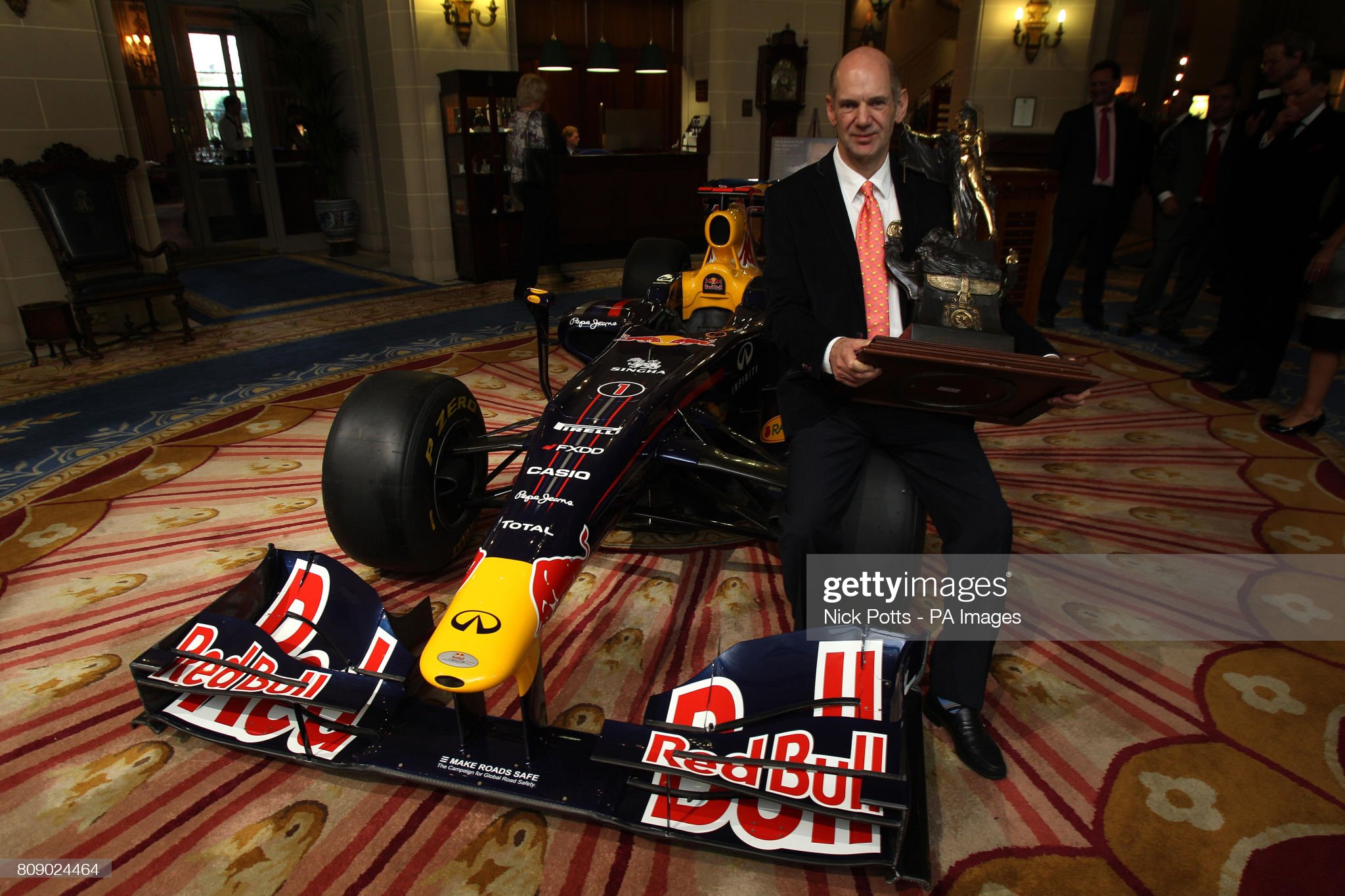 Adrian Newey holds the Segrave Trophy, an award presented by The Royal Automobile Club at the RAC Club, London, on 30 March 2011. 