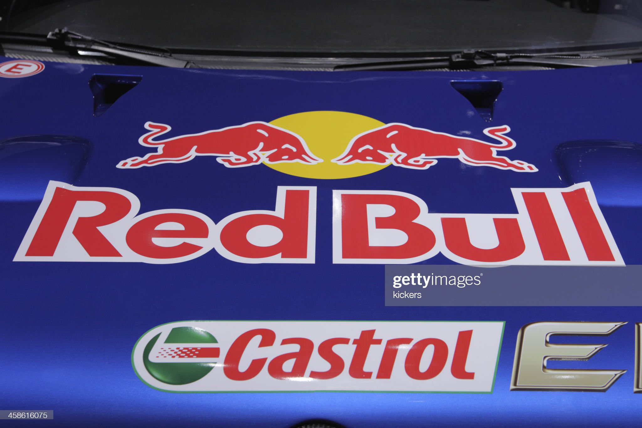 Frankfurt, Germany, 25 September 2011: the logo of Red Bull Racing Team with two typical bulls fighting each other is attached on the blue metallic hood of a Volkswagen rally car version which is being displayed on the world\'s biggest automobile exhibition, the IAA in Frankfurt. 