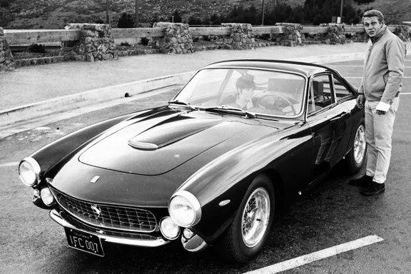 Steve McQueen, a girl and a black Ferrari.