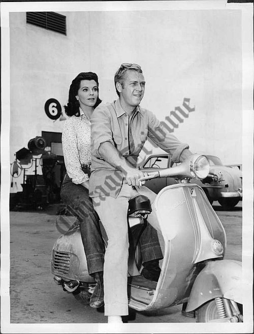 Steve McQueen on a Vespa with a girl.