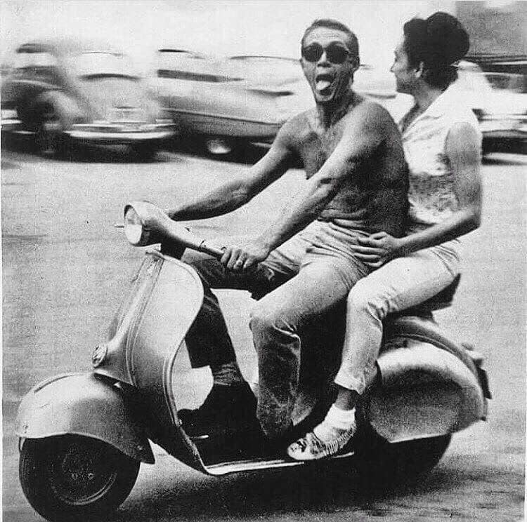 The epitome of cool, Steve McQueen, on a Vespa with a girl.