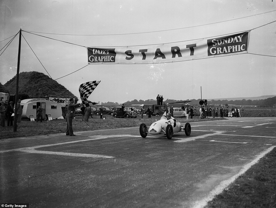 Moss claims the chequered flag in one of his first-ever races on the Goodwood Estate on September 18, 1948.