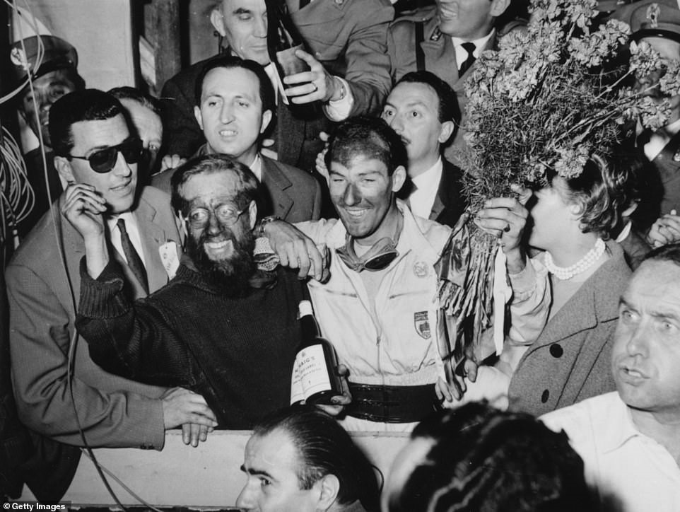 Moss enjoys his winning parade at Mille Miglia, where he set a new course record.