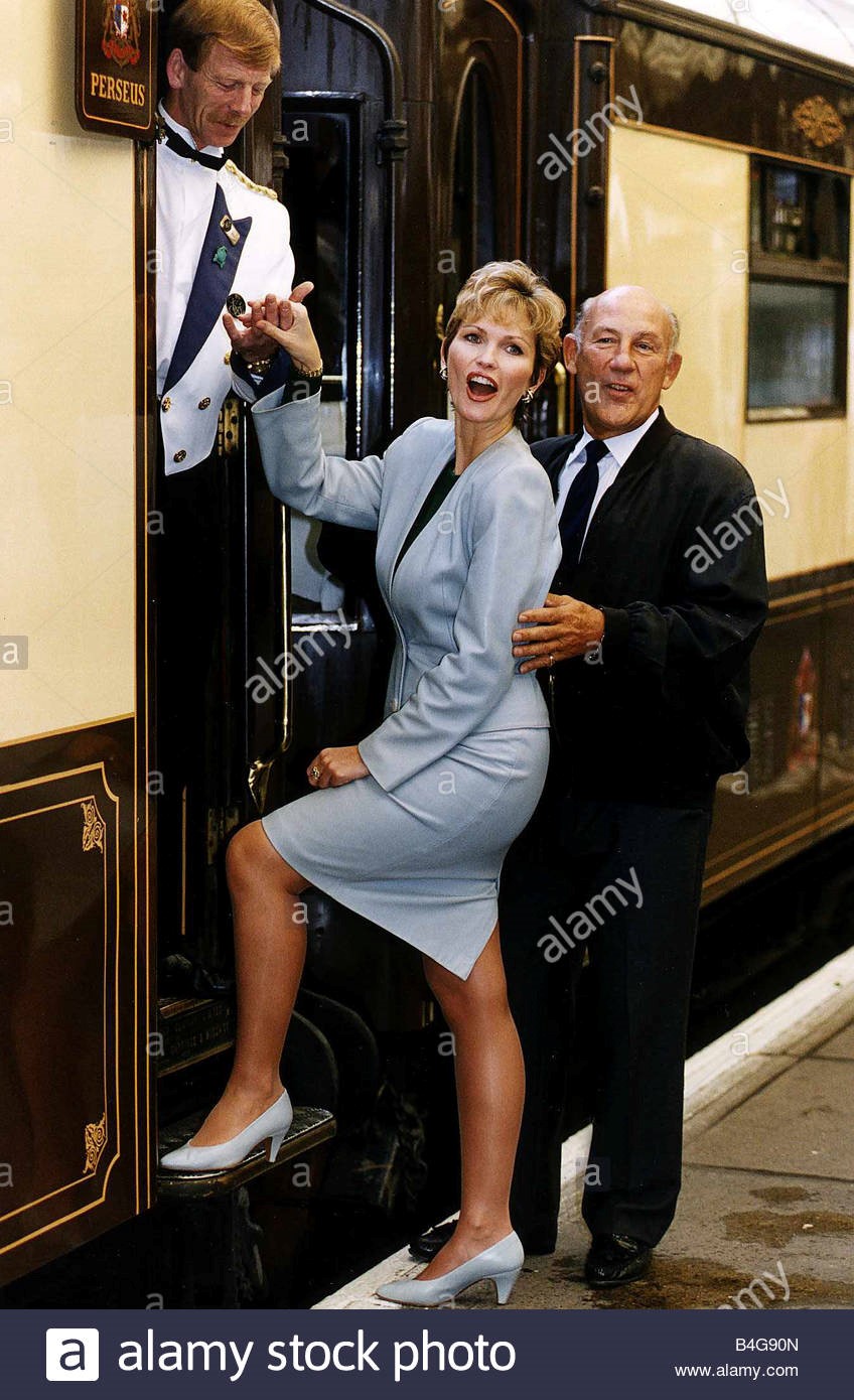 09 September 1993. Stirling Moss with actress Fiona Fullerton launch The Orient Express Trophy from Victoria Station.