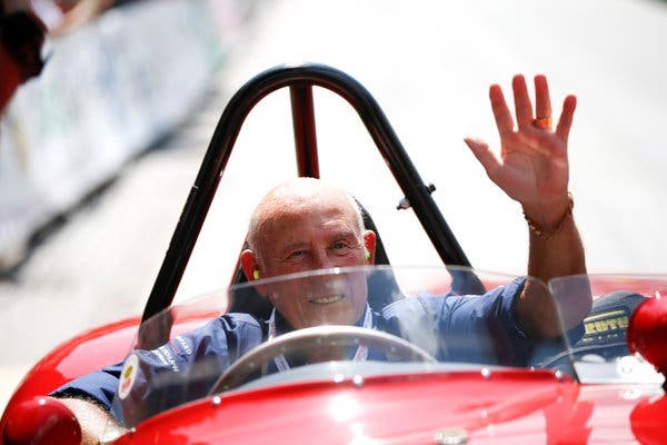Moss waving to spectators from a 1955 Ferrari 750 Monza during the Ennstal-Classic rally in 2013. 