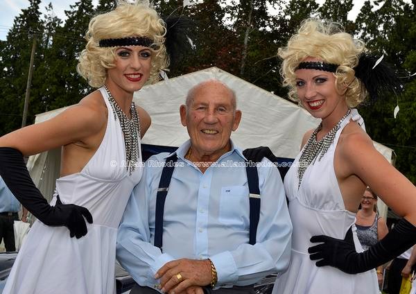 Stirling Moss with two women.