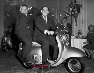 Stirling Moss on a motor scooter.