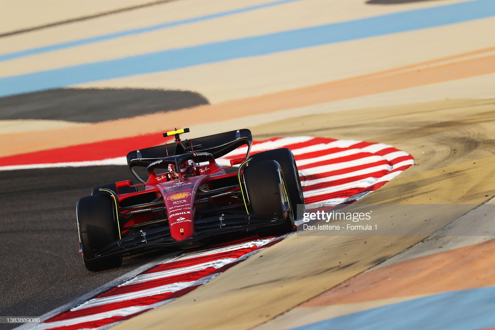 Carlos Sainz driving the Ferrari F1-75 on track.