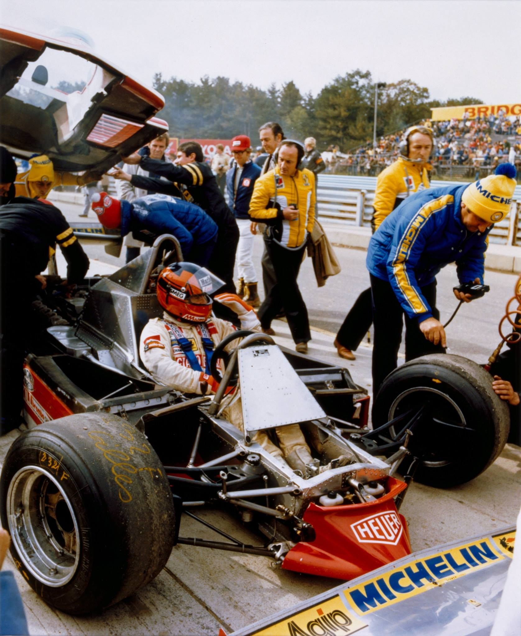 Gilles Villeneuve sitting in his Ferrari 126 C before a race.
