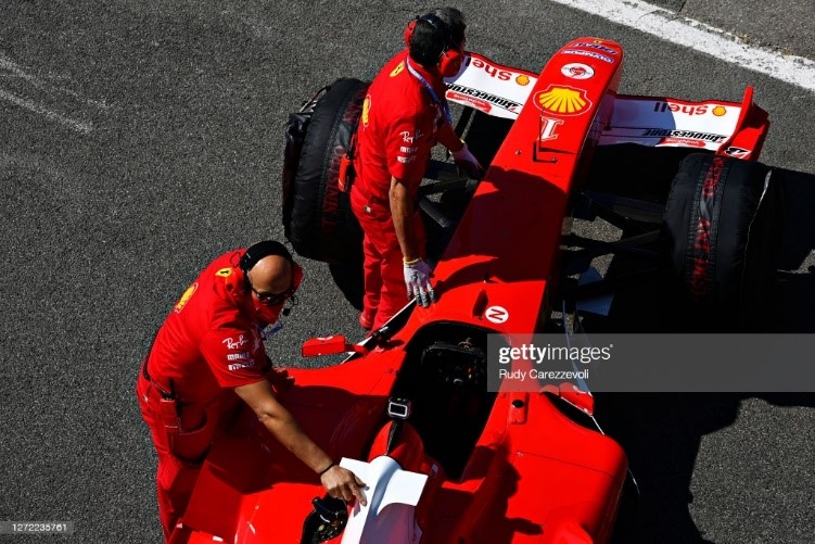 Ferrari team members prepare the Ferrari F2004 of Michael Schumacher for a display run before the F1 Grand Prix of Tuscany at Mugello Circuit on September 13, 2020 in Scarperia, Italy.
