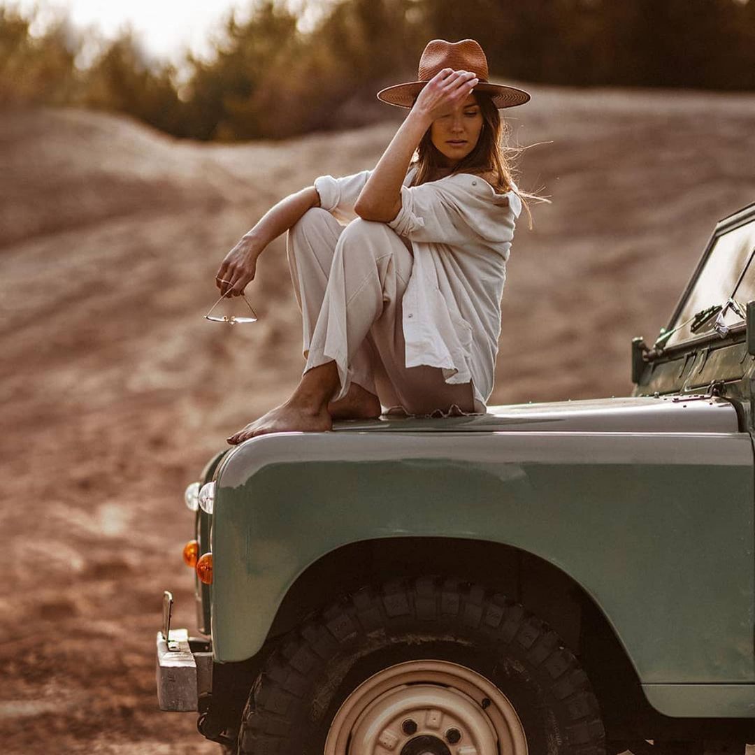 A girl on a Land Rover.