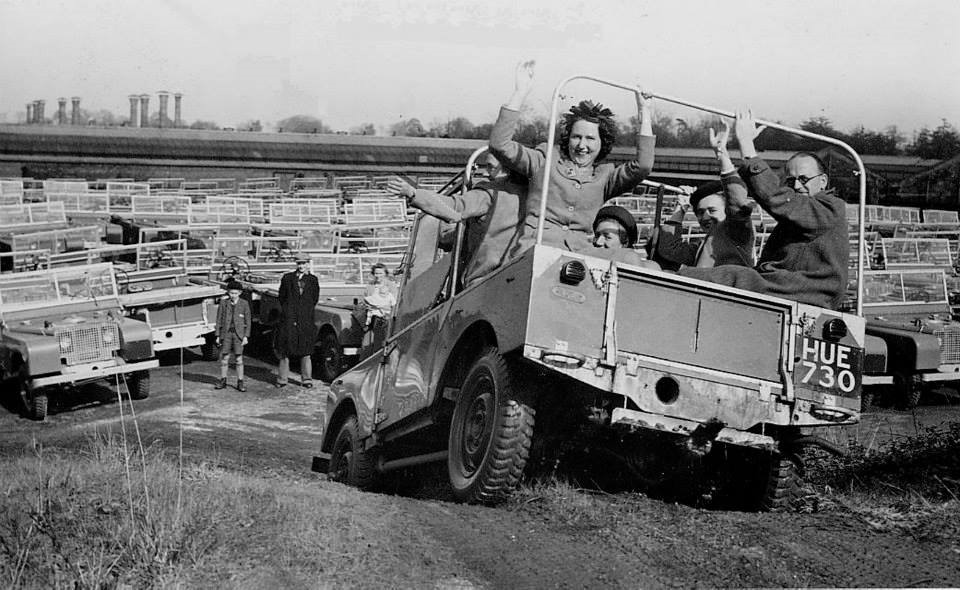 Some people on a Land Rover.