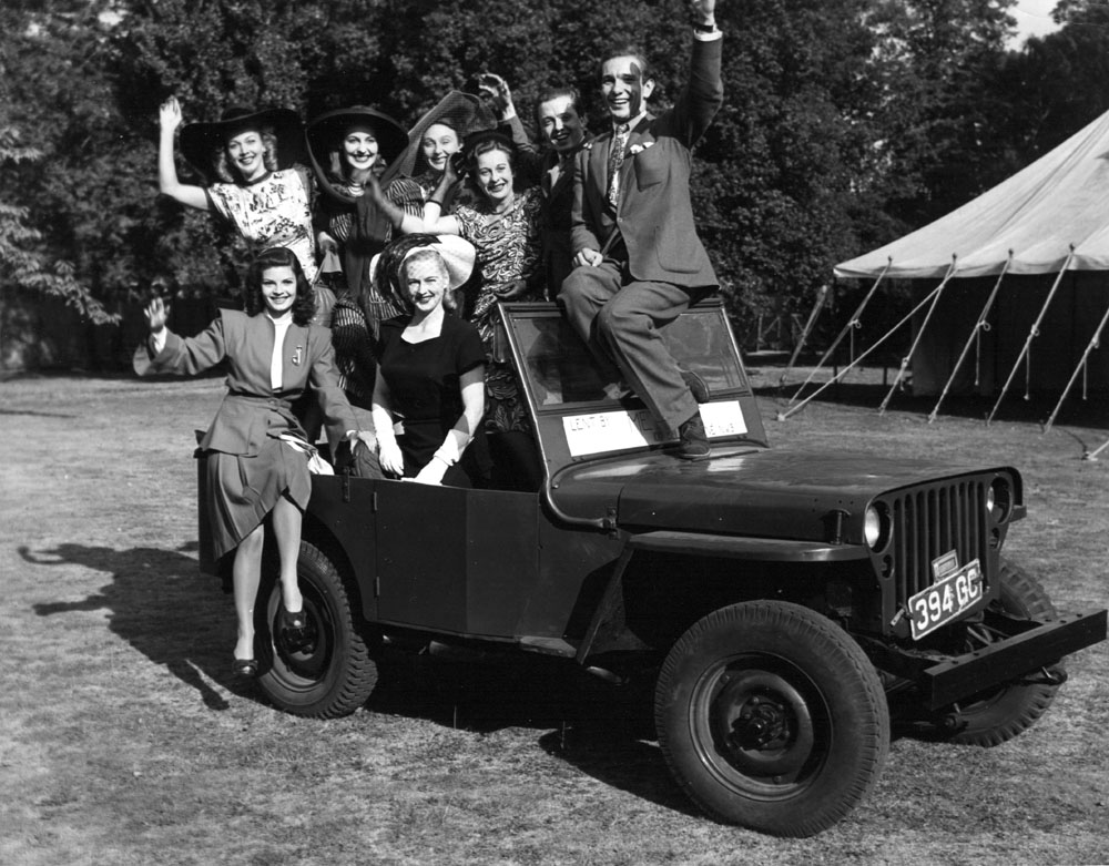 Movie star Carole Landis in a jeep.