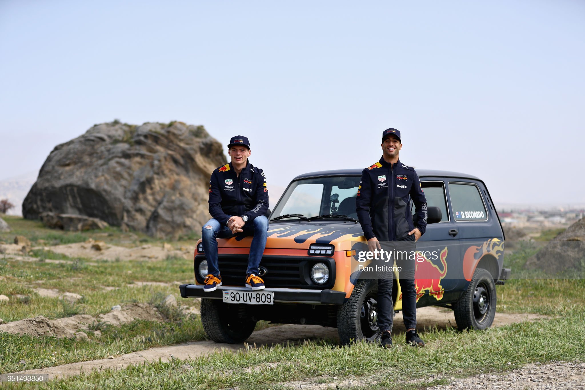 Daniel Ricciardo of Australia and Red Bull Racing and Max Verstappen of Netherlands and Red Bull Racing drive a Lada Niva in Gobustan 