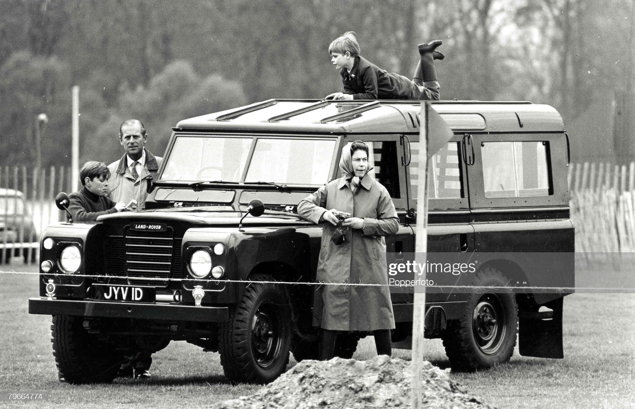 Royalty, 20th April 1972. A picture of Prince Edward on the roof of the Royal car watching the Windsor horse trials with, left to right, Prince Andrew, Duke of Edinburgh (Prince Philip) and H.R.H Queen Elizabeth II.