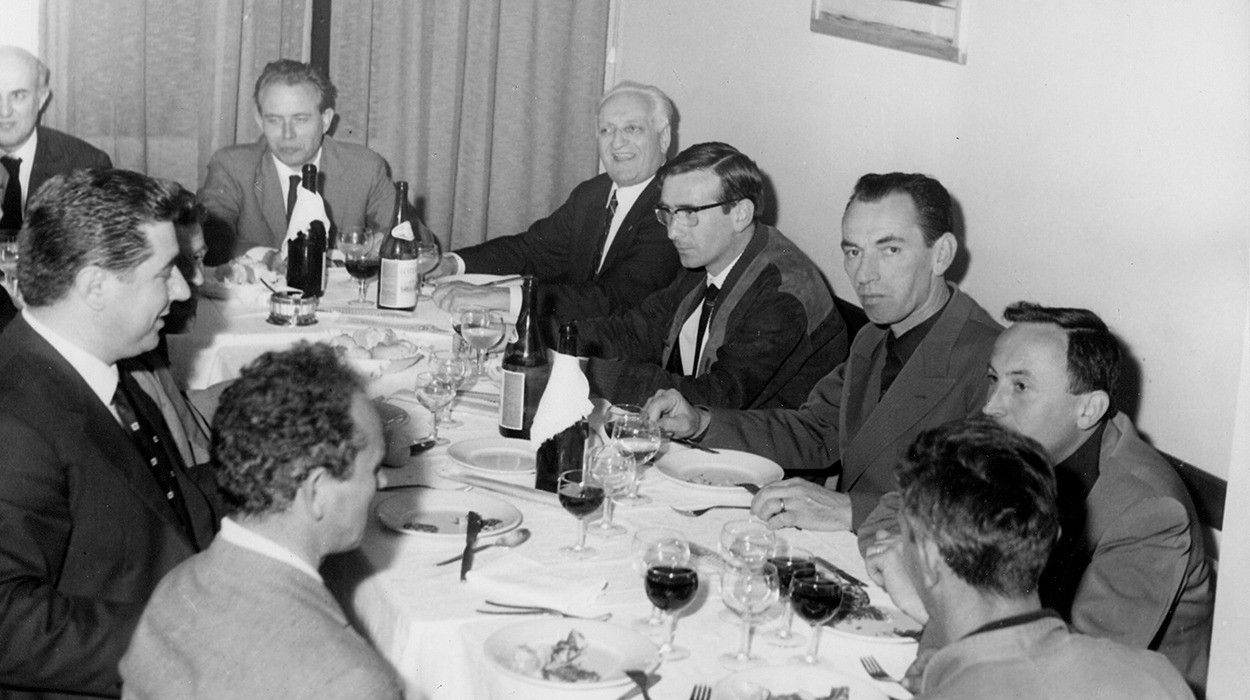 Enzo Ferrari (back corner) dines in the Cavallino in 1966 with his colleagues. 
