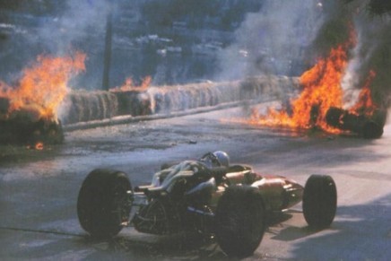 The Monaco Grand Prix, Monte Carlo, May 07, 1967. Chris Amon in the remaining Ferrari passes the horrifying crash of his teammate, Lorenzo Bandini. 